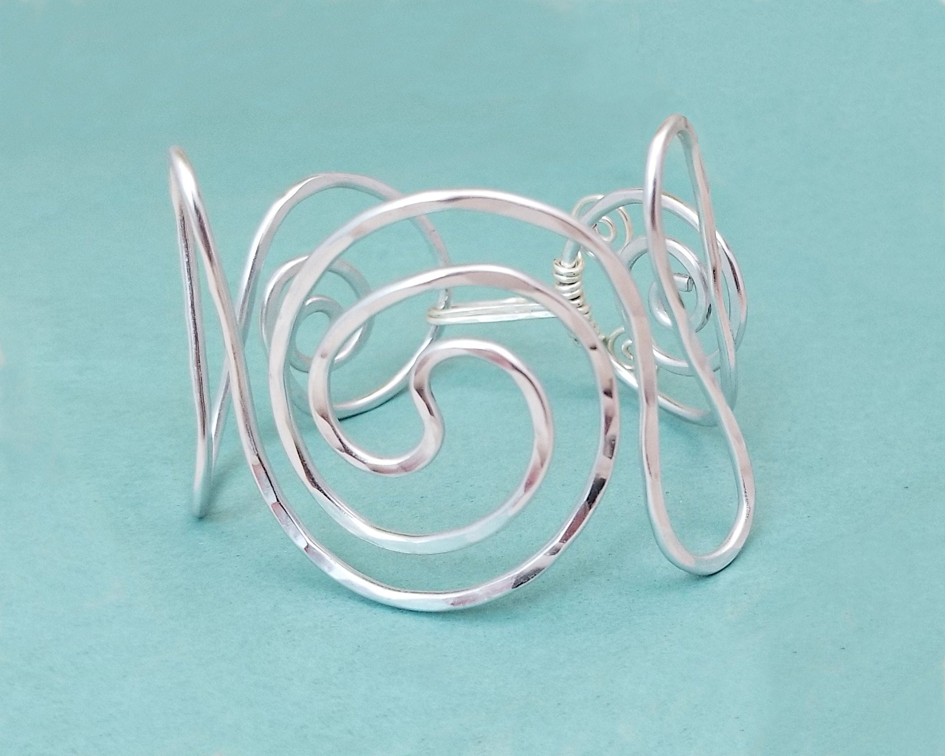 Minimalist Statement Cuff, Central Spiral Design, Hammered Wire, Adjustable, Lightweight, Choice of Colors and Metals